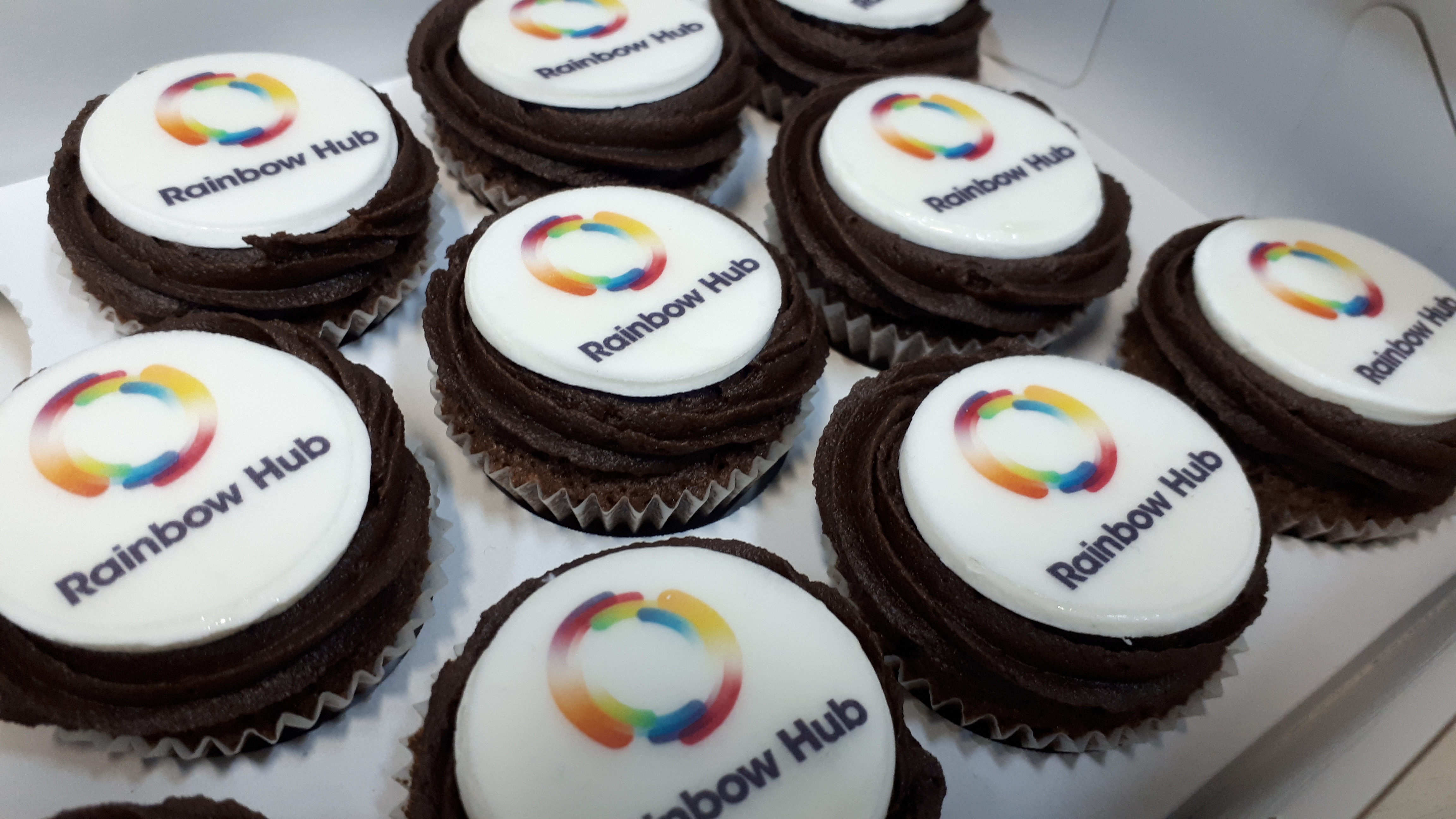 Photo of Rainbow Hub logo on cupcakes