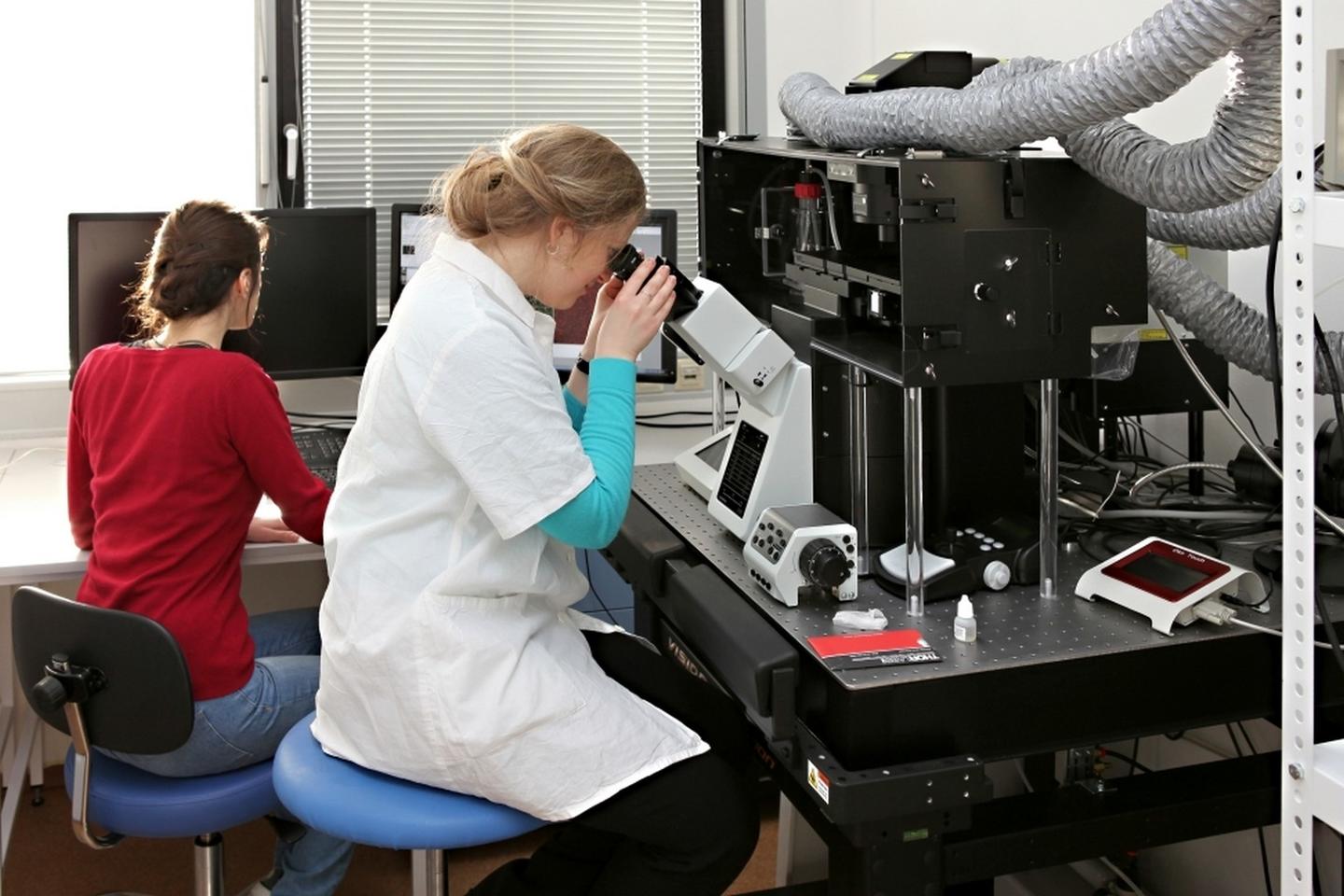 Two women researchers working in a lab