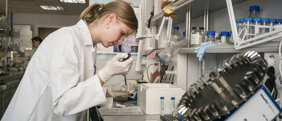 A young woman working in a research lab